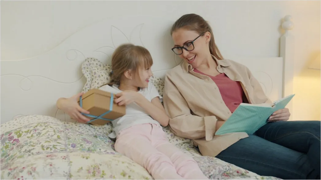 Detail Child Reading Book With Parent At Home Number 2