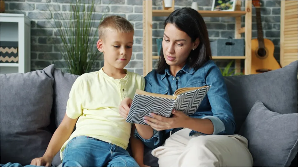 Detail Child Reading Book With Parent At Home Number 16