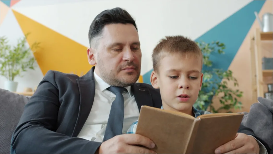 Detail Child Reading Book With Parent At Home Number 6