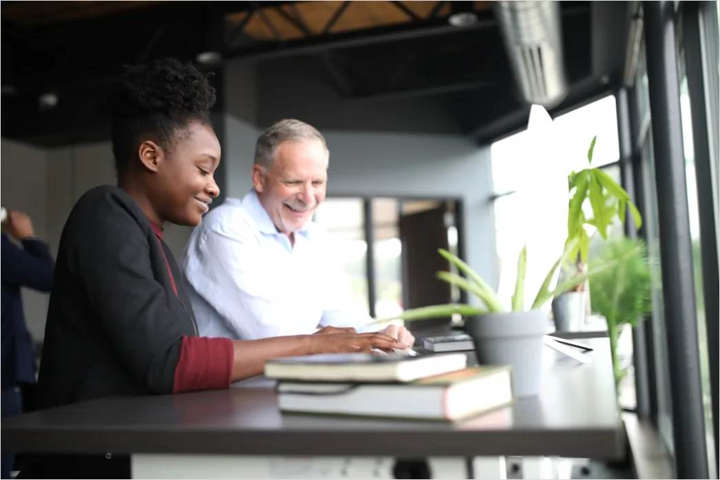Detail High School Teacher Helping Student At Desk Number 13