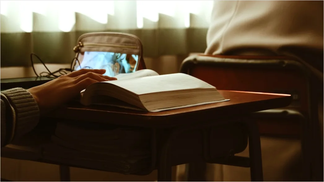 Detail High School Teacher Helping Student At Desk Number 16