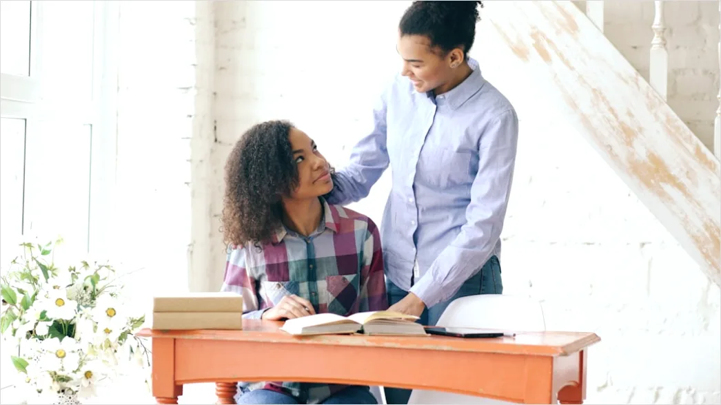 Detail High School Teacher Helping Student At Desk Number 3