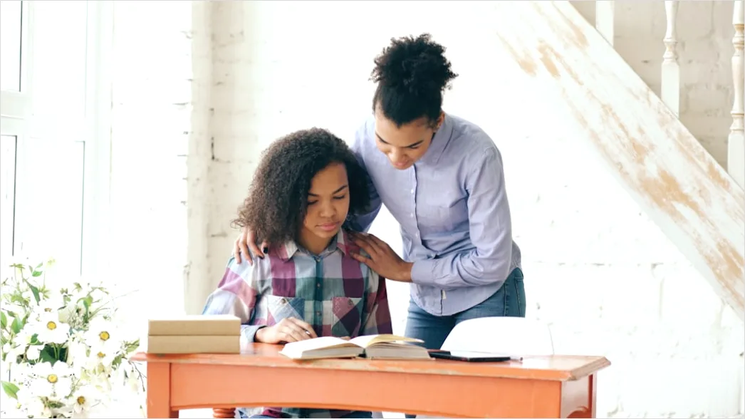 Detail High School Teacher Helping Student At Desk Number 4