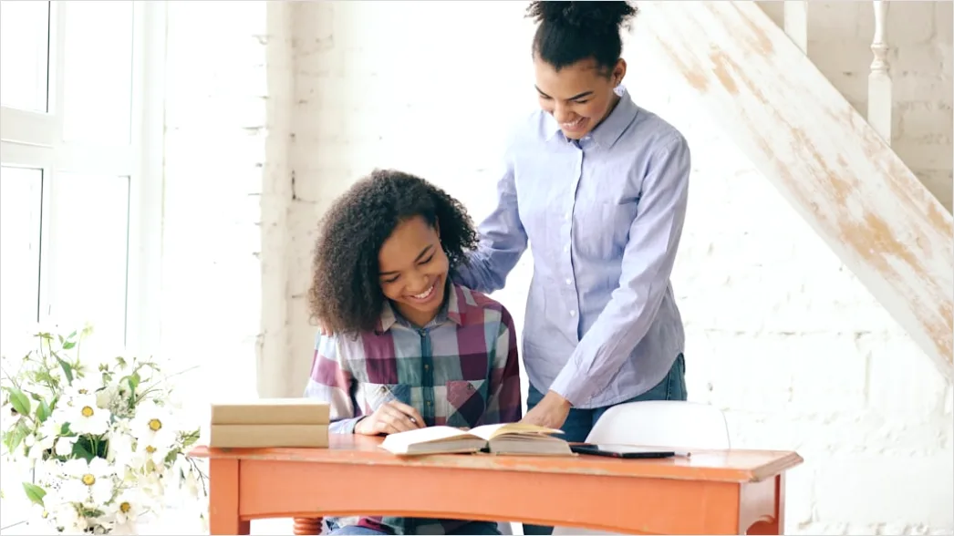 Detail High School Teacher Helping Student At Desk Number 5