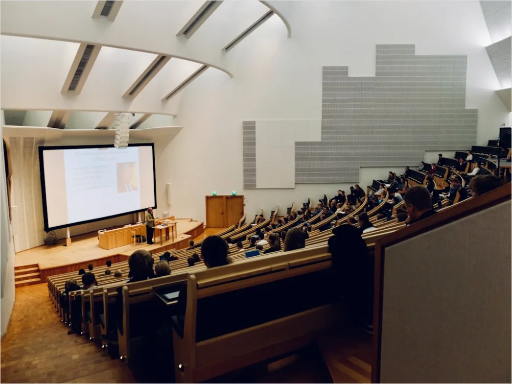 Lecture Hall Students Seated Listening Attentively Bb3a