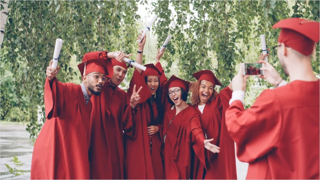Students Celebrating Graduation Outdoors Group Photo 3c97