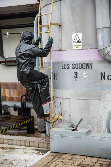 Chemical Plant Maintenance Worker Inspecting Equipment
