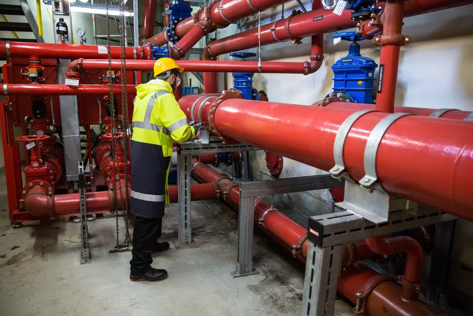 Detail Chemical Plant Maintenance Worker Inspecting Equipment Number 2