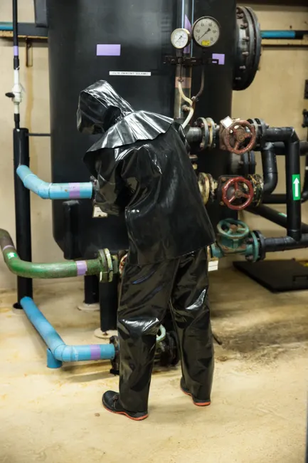 Detail Chemical Plant Maintenance Worker Inspecting Equipment Number 12