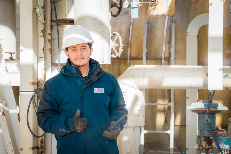 Detail Chemical Plant Maintenance Worker Inspecting Equipment Number 3