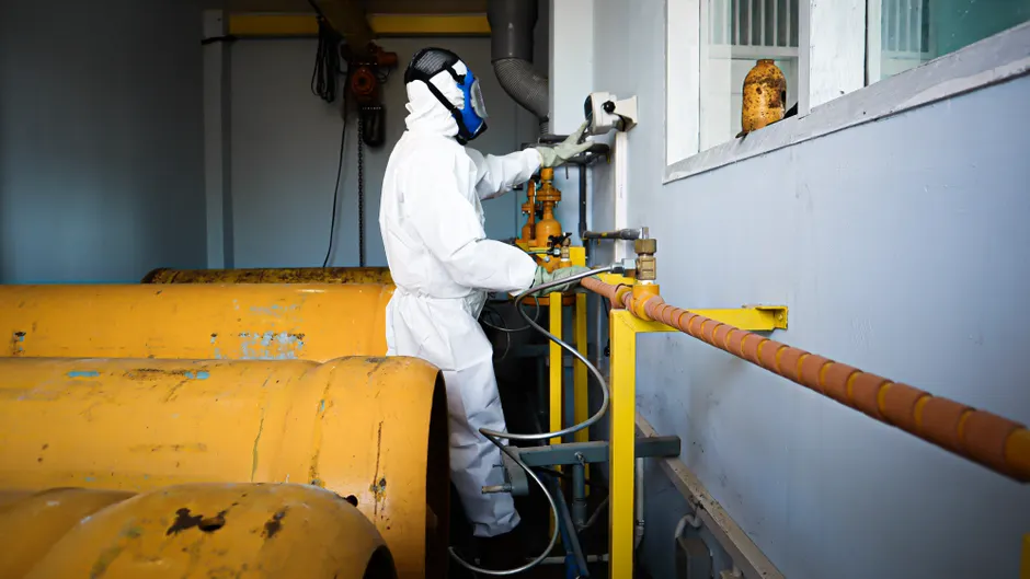 Detail Chemical Plant Maintenance Worker Inspecting Equipment Number 6