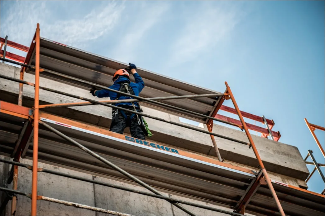 Construction Worker Wearing Safety Harness At Height F008