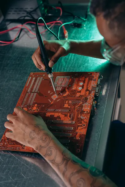 Detail Electronics Assembly Line Workers Soldering Circuit Boards Number 2