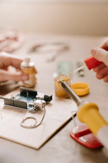 Detail Electronics Assembly Line Workers Soldering Circuit Boards Number 16