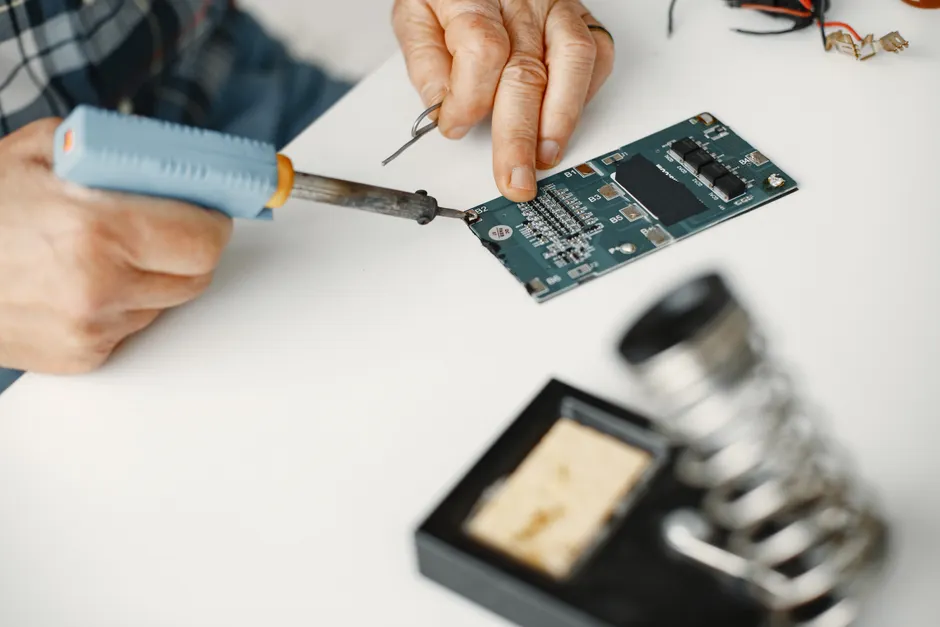 Detail Electronics Assembly Line Workers Soldering Circuit Boards Number 17
