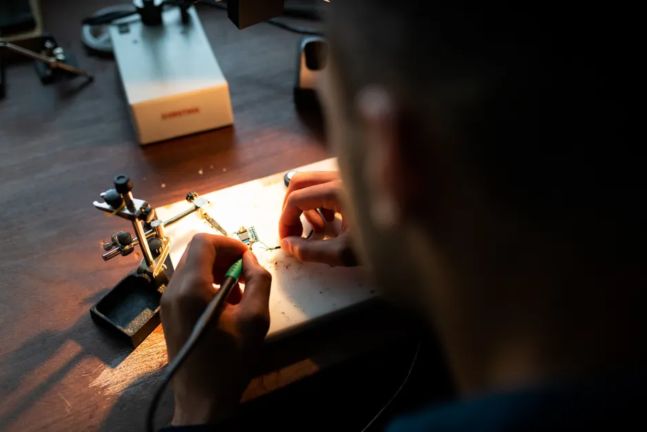 Detail Electronics Assembly Line Workers Soldering Circuit Boards Number 18