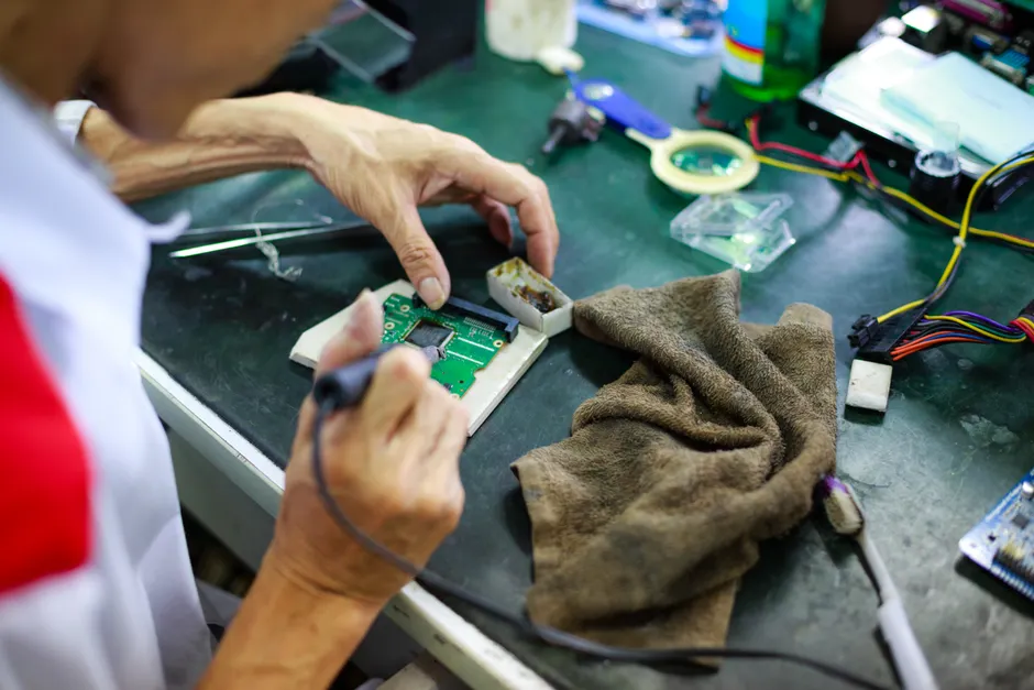 Detail Electronics Assembly Line Workers Soldering Circuit Boards Number 4