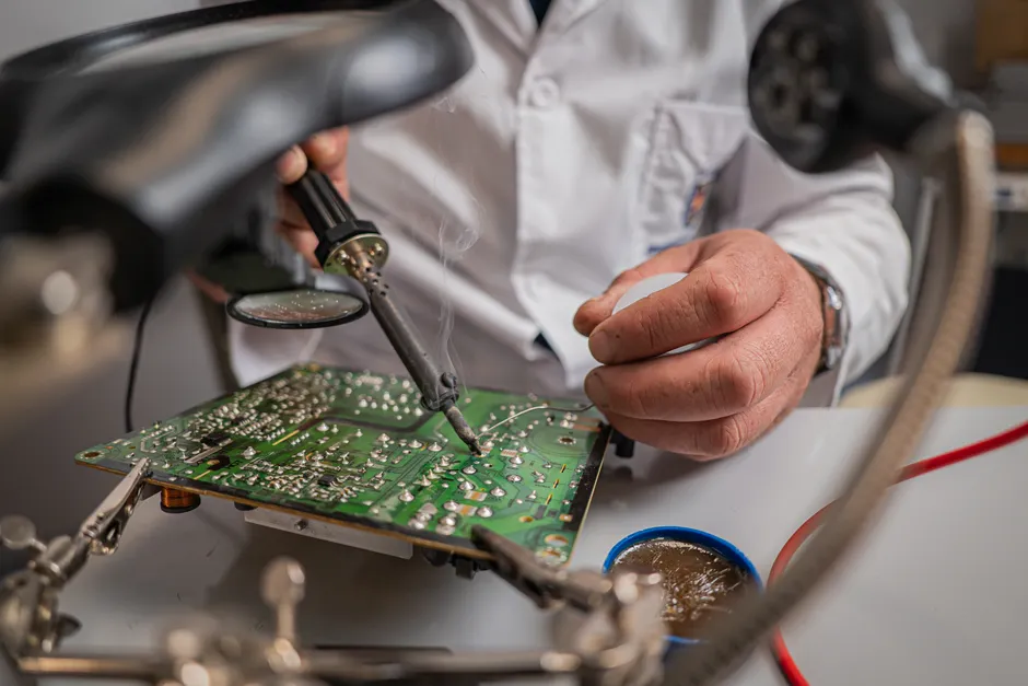 Detail Electronics Assembly Line Workers Soldering Circuit Boards Number 7
