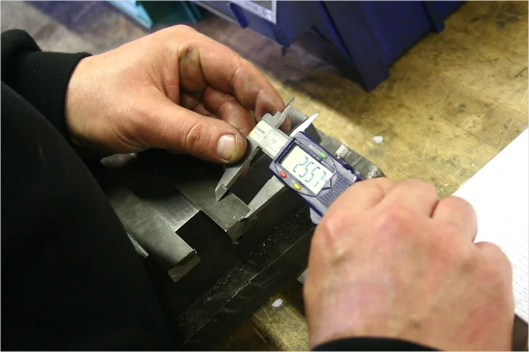 Detail Engineer Measuring Component With Caliper Close Up Number 11