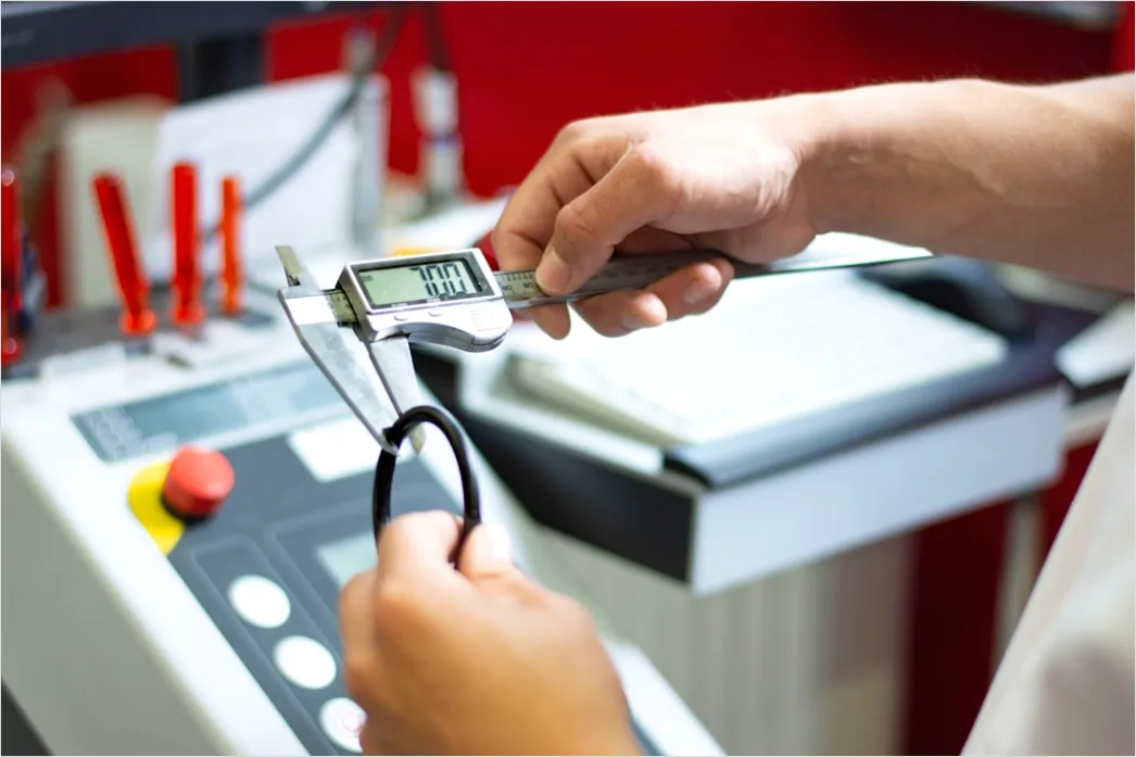 Detail Engineer Measuring Component With Caliper Close Up Number 3