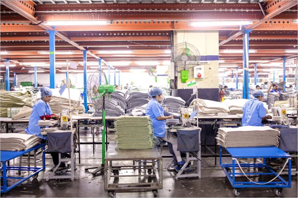 Detail Factory Floor Workers In Safety Gear Working Number 7