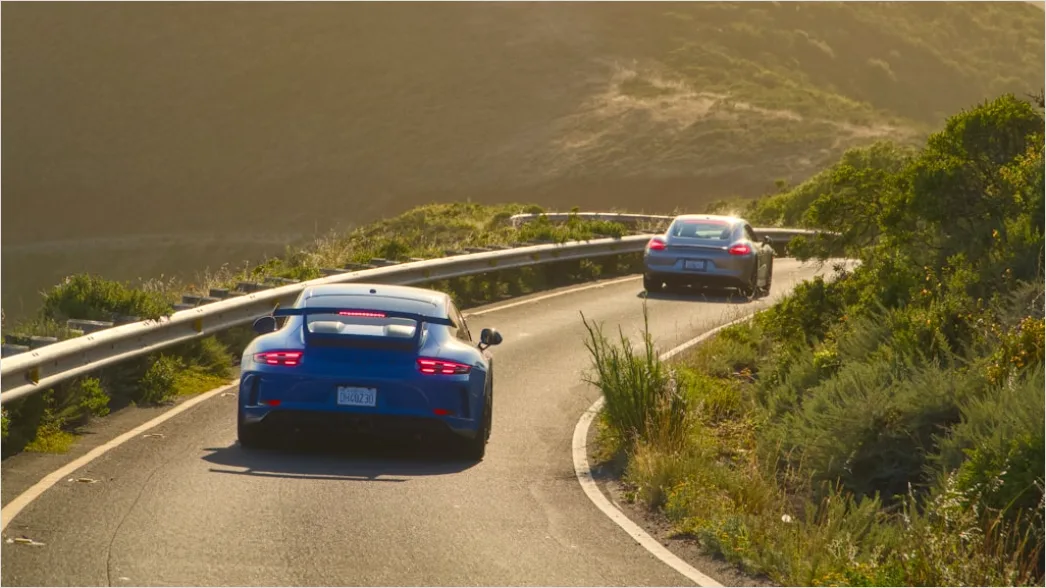 Detail Ferrari Driving On Coastal Road Aerial View Number 2