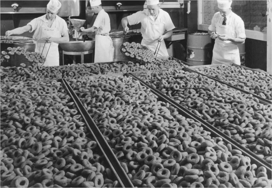 Food Processing Factory Workers In Hygiene Suits