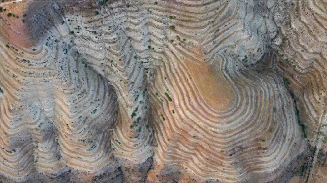 Detail Geologist Examining Rock Formations In Field Number 8