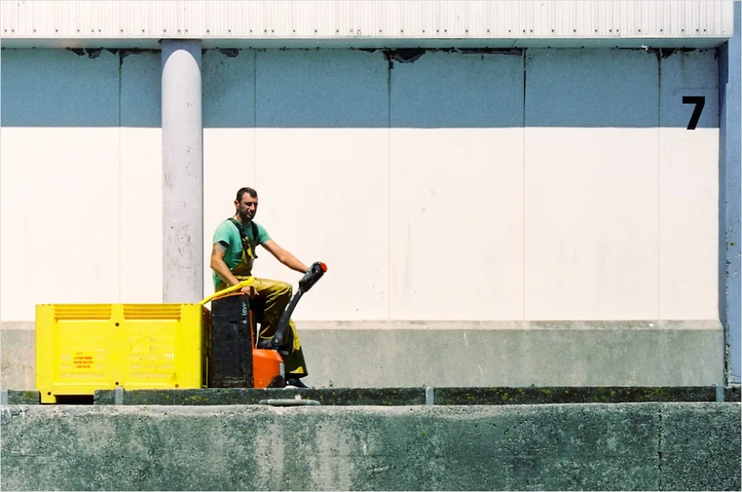Detail Logistics Worker Loading Truck At Dock Number 4