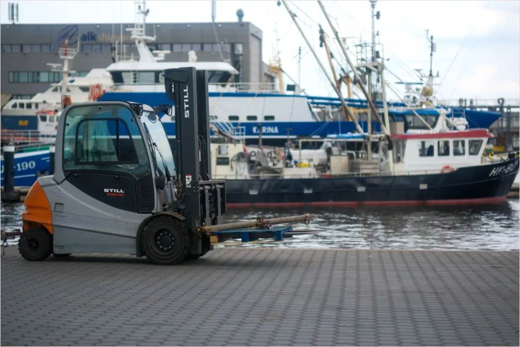 Detail Logistics Worker Loading Truck At Dock Number 5