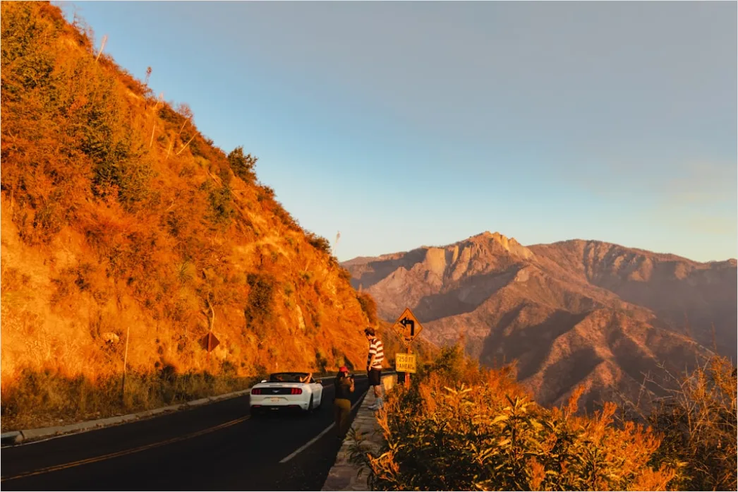 Detail Luxury Sports Car On Mountain Road Sunset Number 11