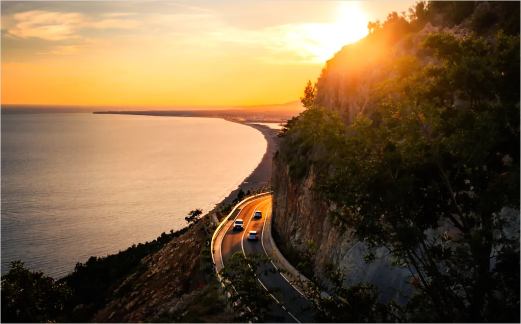 Detail Luxury Sports Car On Mountain Road Sunset Number 12