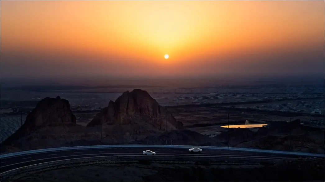 Detail Luxury Sports Car On Mountain Road Sunset Number 7