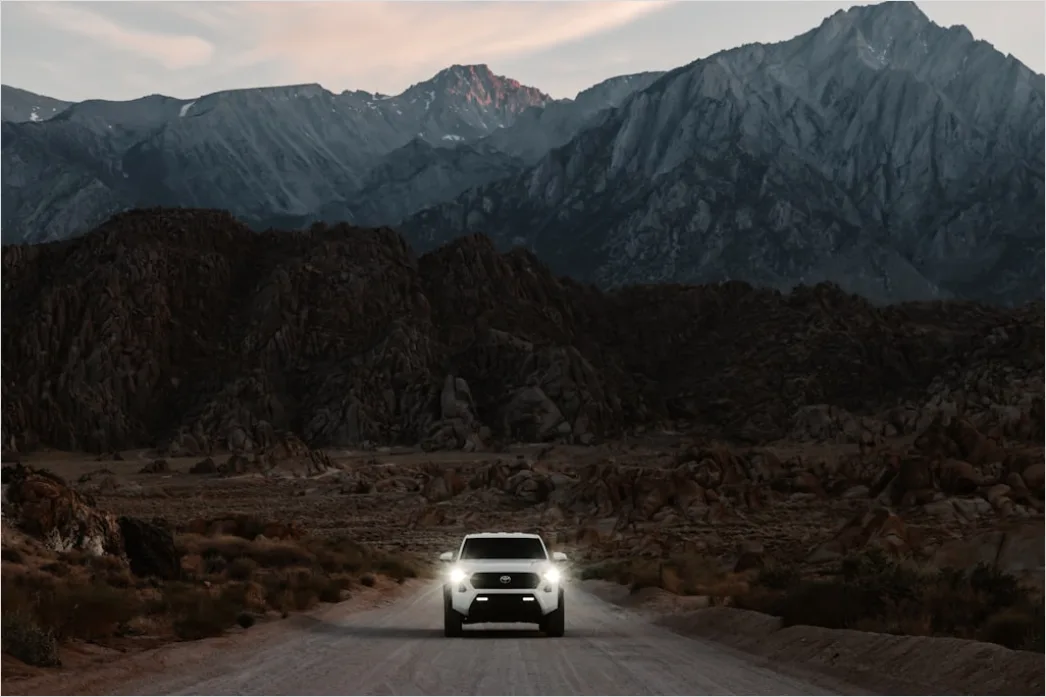 Detail Luxury Sports Car On Mountain Road Sunset Number 10