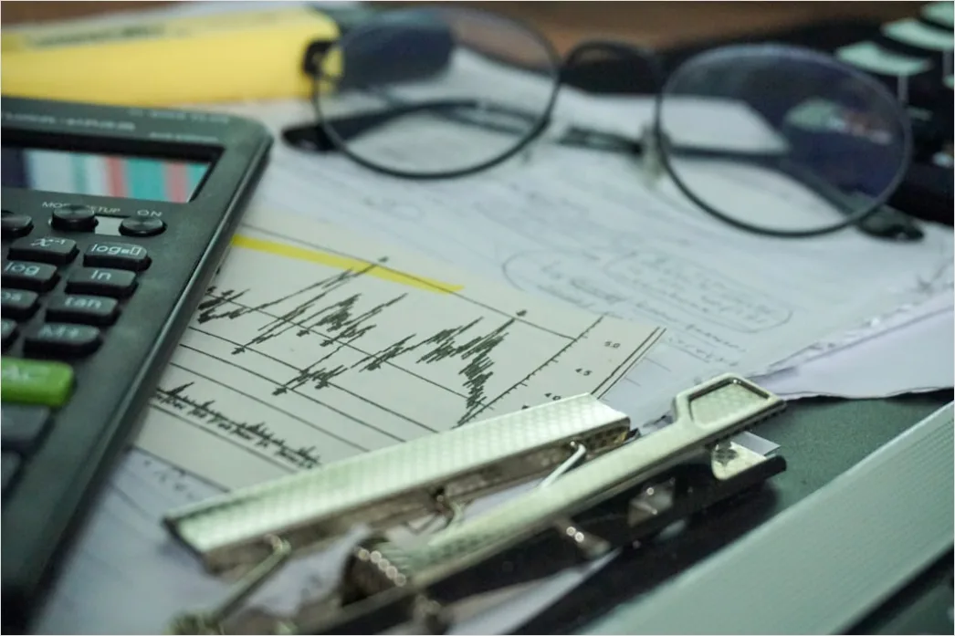 Detail Research Paper Figures And Graphs On Desk Number 9