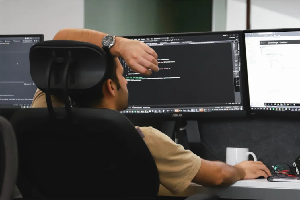 Detail Researcher Analyzing Data On Multiple Monitors Number 15