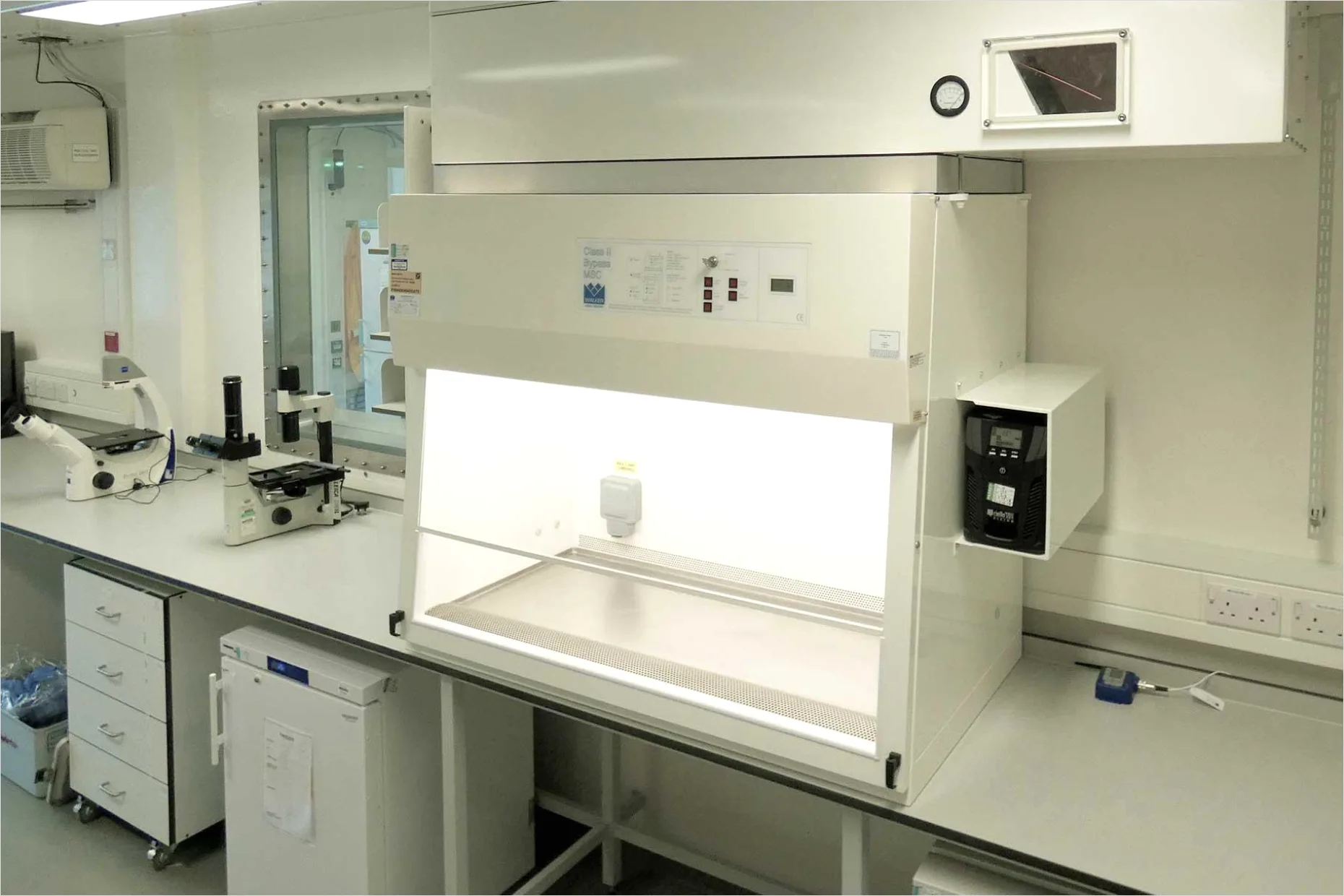 Detail Researcher Using Biosafety Cabinet In Lab Number 11