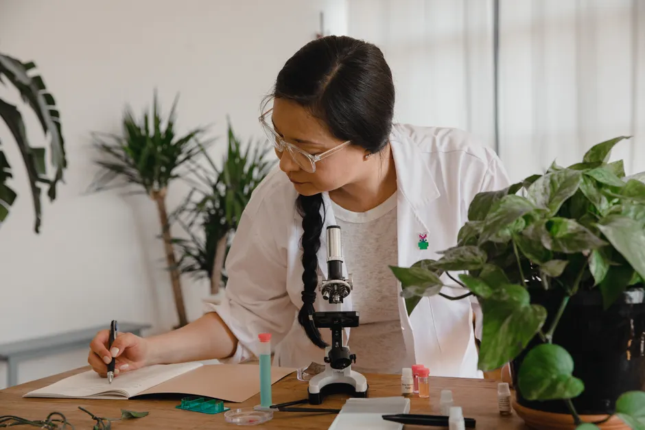 Detail Scientist Writing Notes In Lab Notebook Number 2