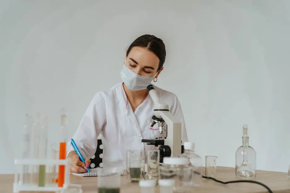 Detail Scientist Writing Notes In Lab Notebook Number 12