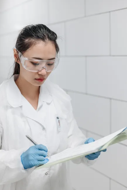 Detail Scientist Writing Notes In Lab Notebook Number 17