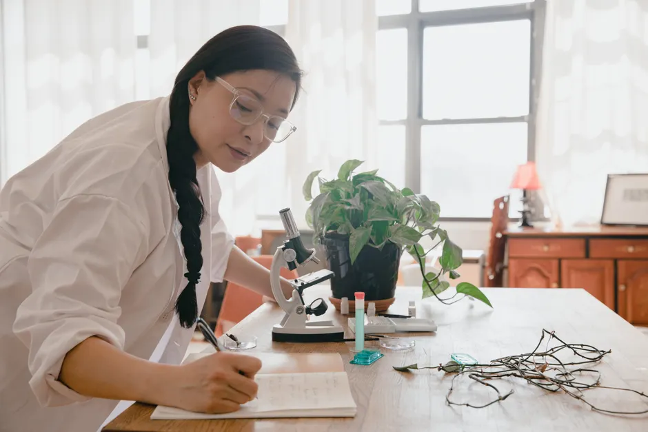 Detail Scientist Writing Notes In Lab Notebook Number 20