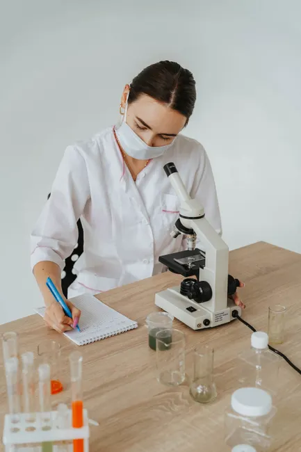 Detail Scientist Writing Notes In Lab Notebook Number 5