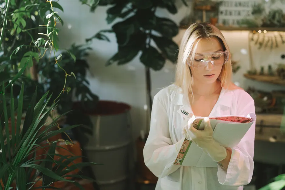 Detail Scientist Writing Notes In Lab Notebook Number 6
