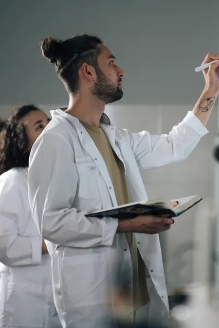 Detail Scientist Writing Notes In Lab Notebook Number 8