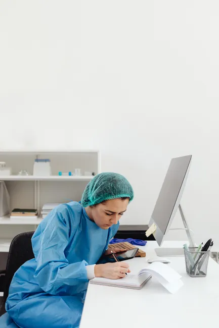 Detail Scientist Writing Notes In Lab Notebook Number 9