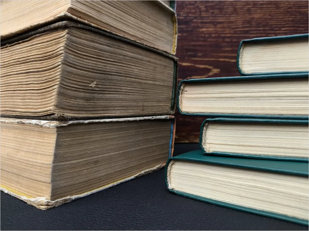 Detail Stack Of Textbooks On Table Close Up Number 2
