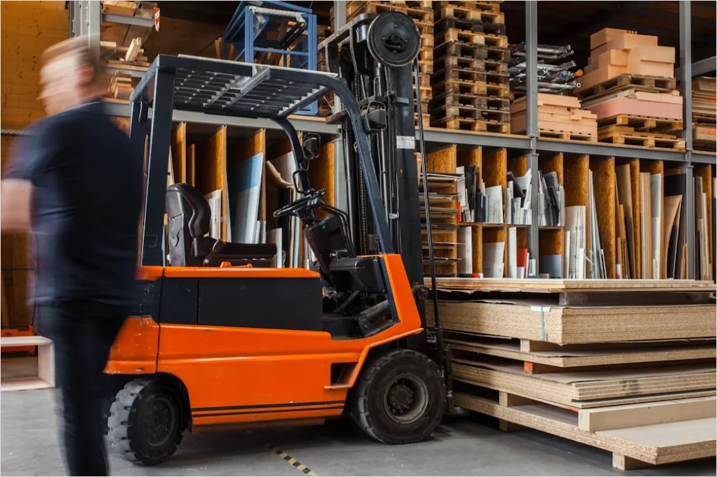 Warehouse Worker Using Forklift Moving Pallets 4275