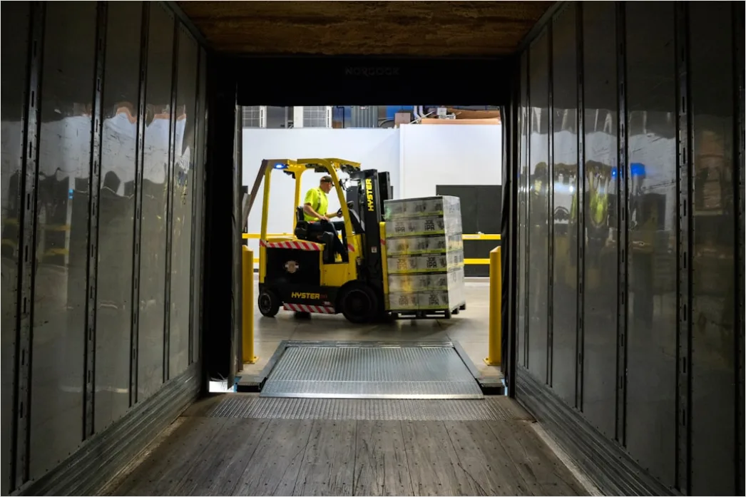 Detail Warehouse Worker Using Forklift Moving Pallets Number 3