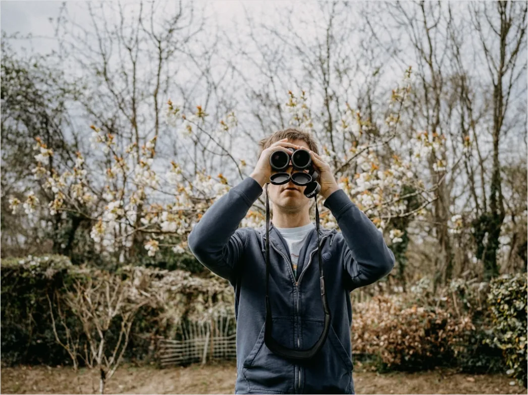Detail Wildlife Researcher Observing Animals With Binoculars Number 17