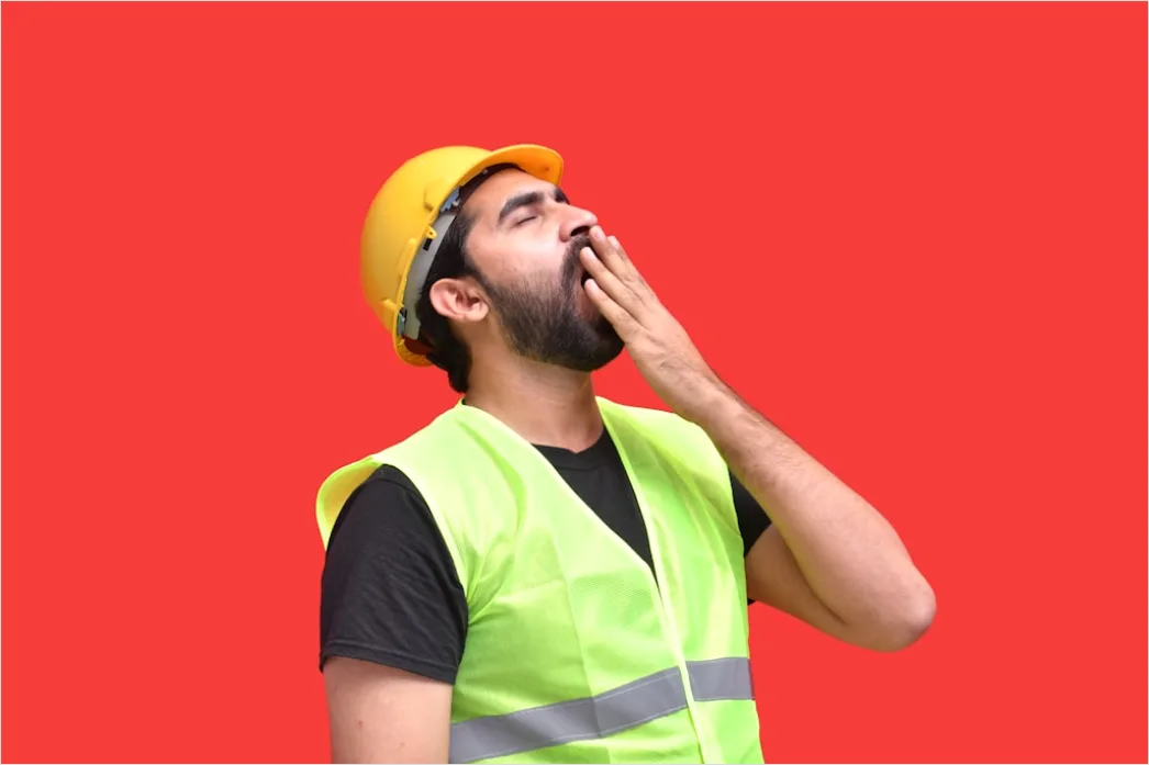Detail Worker Wearing Hard Hat And High Vis Vest Number 12